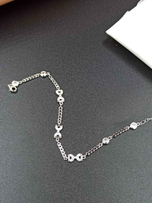 Delicate Silver Bracelet with Bow Design - Image 3