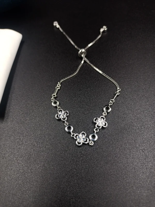 Adjustable Silver Bracelet with Floral Pattern